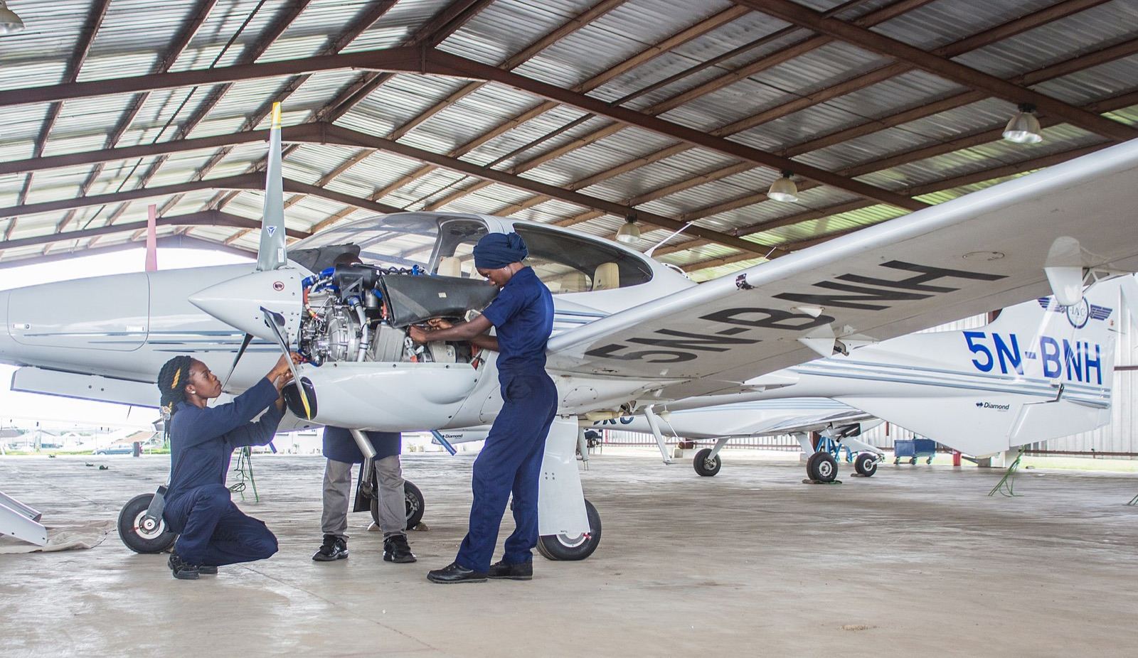 Aircraft engineers working on a plane