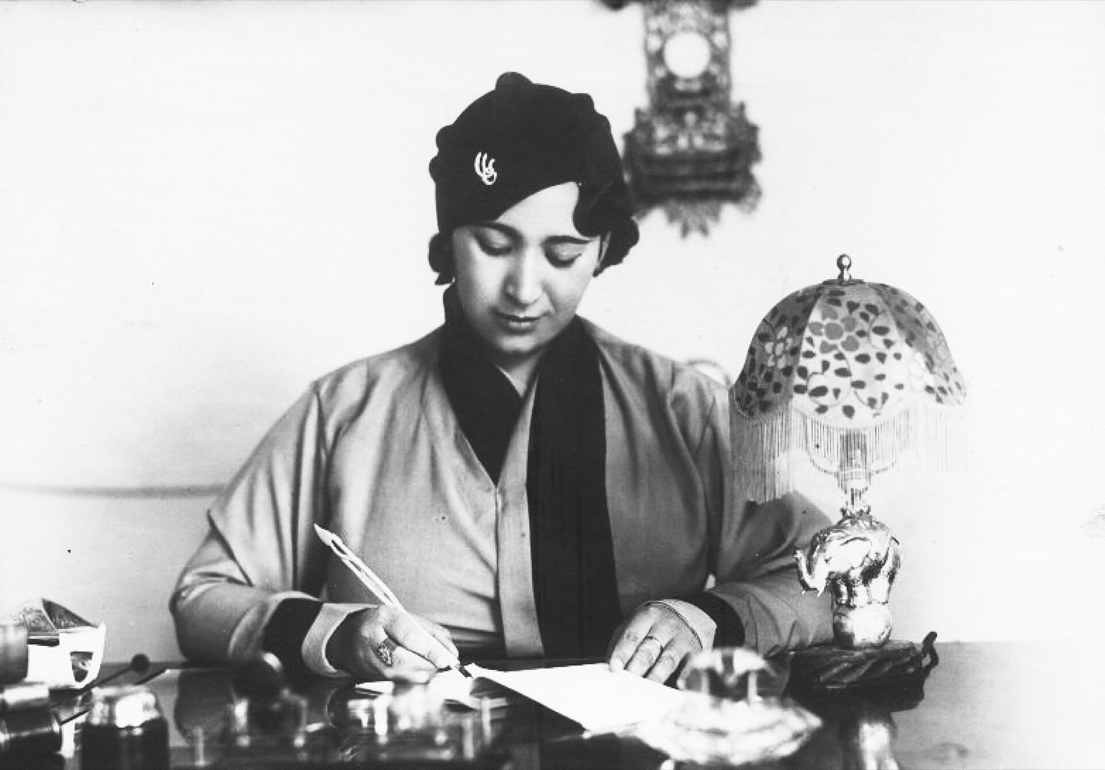 A writer at her desk with papers