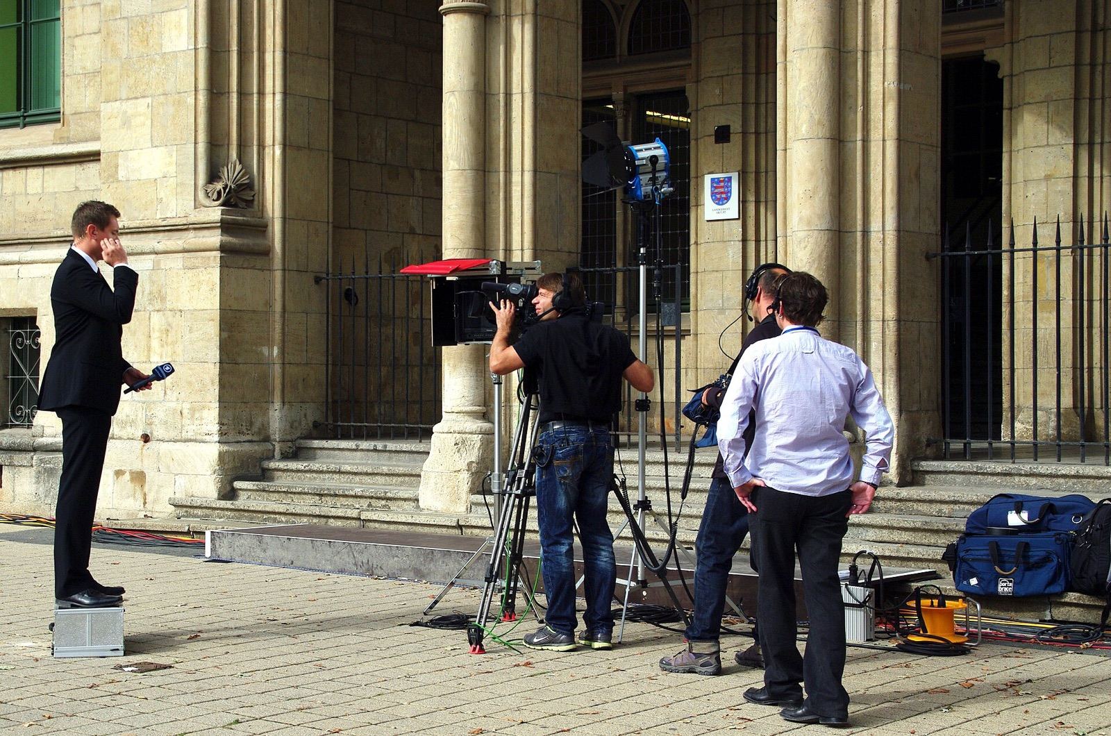 A reporter covering an event with a microphone